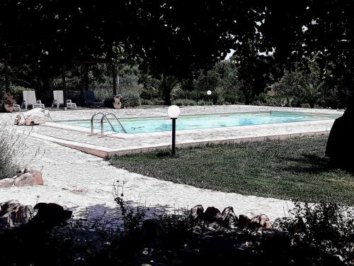 a swimming pool in a yard next to at I 5 SENSI in Marina di Modica