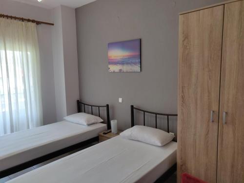 Ένα ή περισσότερα κρεβάτια σε δωμάτιο στο Methexis Apartment