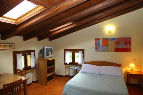 Cama o camas de una habitación en Villaggio Della Salute Più