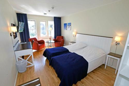 Postel nebo postele na pokoji v ubytování Nordby Hotell