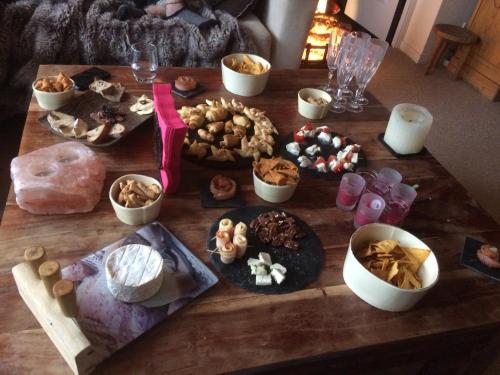 a table with many different types of food on it at Avoriaz cocooning in Avoriaz
