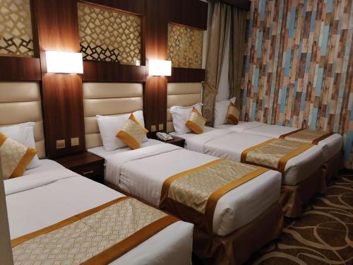 Ένα ή περισσότερα κρεβάτια σε δωμάτιο στο Al Andalus Plus