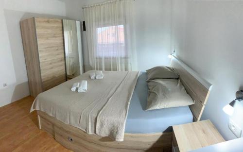 Posteľ alebo postele v izbe v ubytovaní Apartman Bitunjac