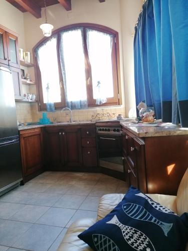a kitchen with a sink and a counter top at Vela Club House in Cagliari
