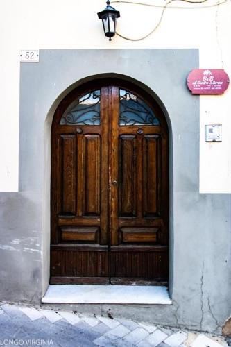 a large wooden door on the side of a building at B&B al centro storico in Troina