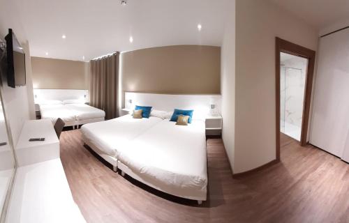 Llit o llits en una habitació de Hotel La Terraza