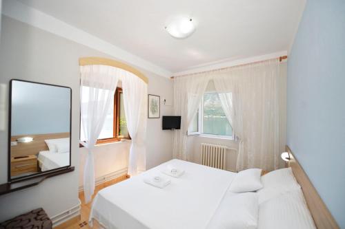Кровать или кровати в номере Pana-Eustahije 253