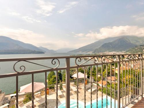 a balcony with a view of the water and mountains at Gravedona Lake Escape in Gravedona