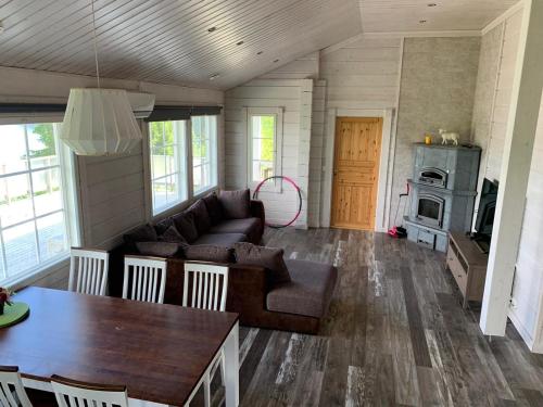 a living room with a couch and a table at VITA Ruokolahti 3 in Ruokolahti