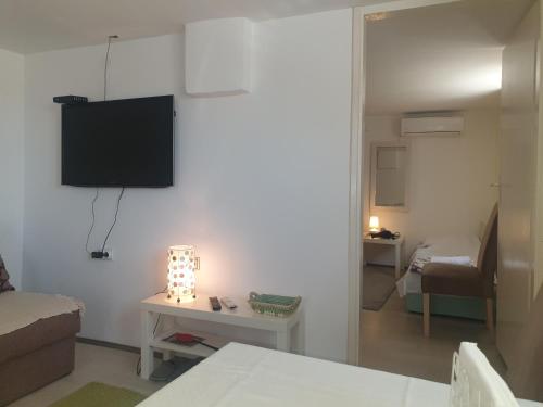 Postel nebo postele na pokoji v ubytování Apartman Bukulja