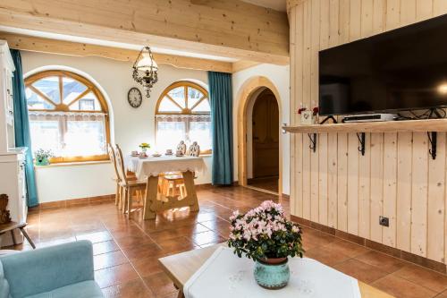 a living room with a couch and a table at Chaty Zakopane in Zakopane