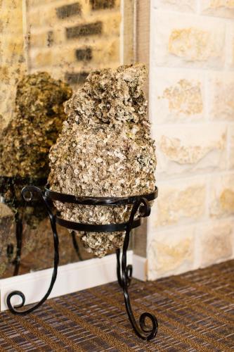 a chair sitting in front of a wall at Boutique Hotel Tate By Aycon in Budva