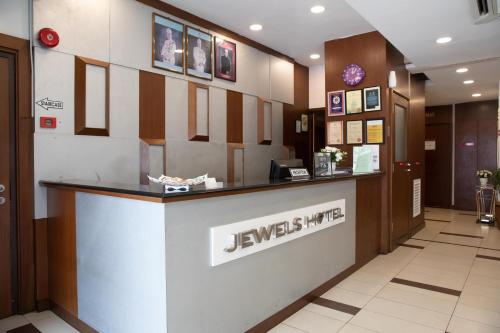 a jwex hotel lobby with a reception counter at Jewels Hotel in Kota Bharu