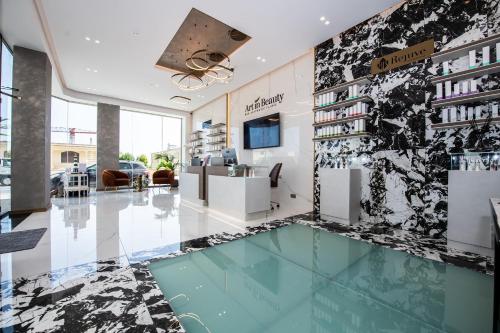 a lobby with a glass floor in a building at Artist Terrace Apartments in Mellieħa