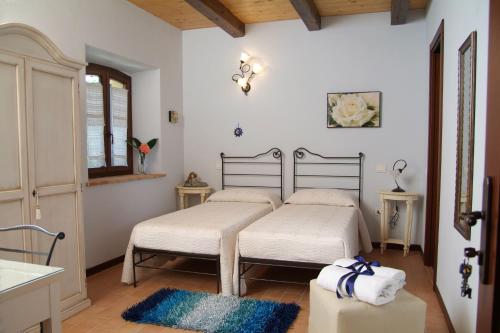 Łóżko lub łóżka w pokoju w obiekcie Agriturismo Al Crepuscolo