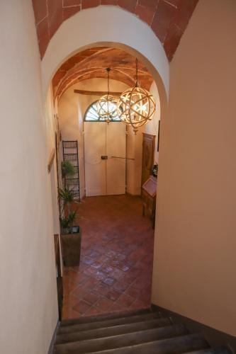 a hallway of a house with a chandelier at B&B La Taccola in Castelnuovo di Val di Cecina