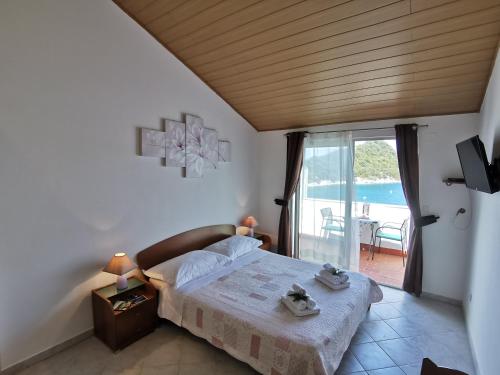 Postel nebo postele na pokoji v ubytování Apartments Marija