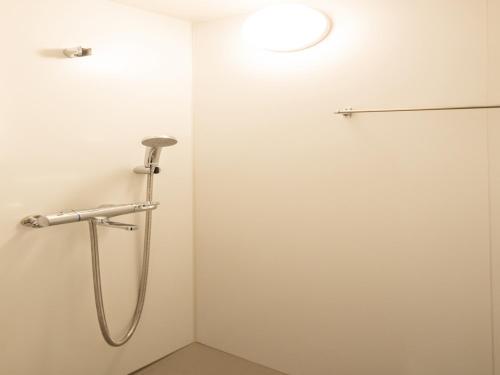 a shower in a bathroom with a shower head at Far East Village Hotel Tokyo Ariake in Tokyo