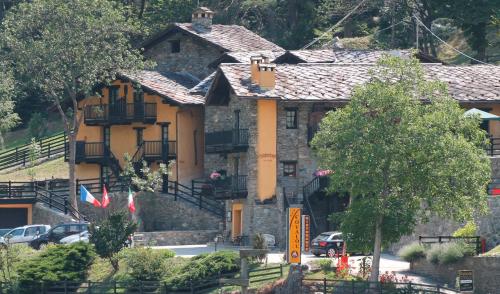 a large stone house on top of a hill at Residence Covalou in Antey-Saint-André