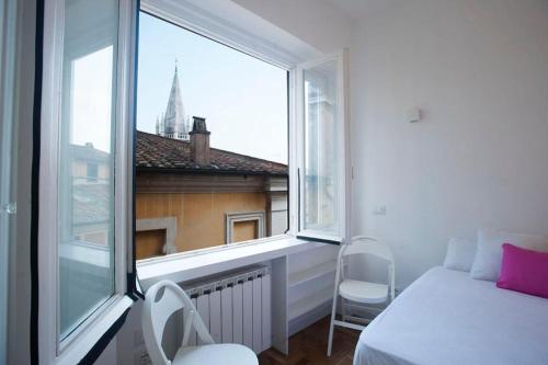 A bed or beds in a room at Erida 2 Apartment Spanish Steps
