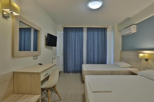Postel nebo postele na pokoji v ubytování Alarzo Rooms