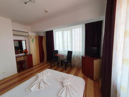 Un ou plusieurs lits dans un hébergement de l'établissement Steluta