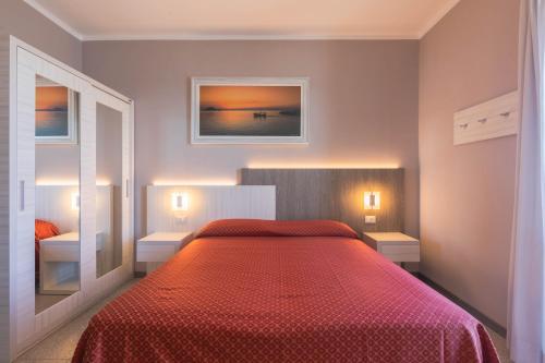 Ένα ή περισσότερα κρεβάτια σε δωμάτιο στο Hotel Danio Lungomare
