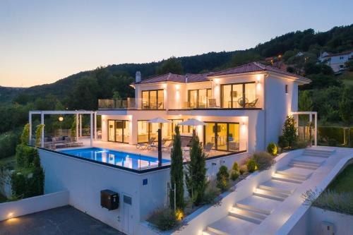 an aerial view of a house with a swimming pool at Villa Elegance in Sinj