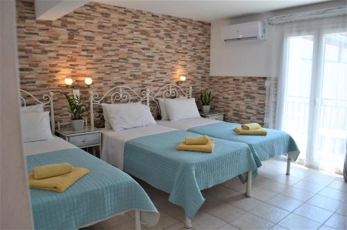 Postel nebo postele na pokoji v ubytování Hotel Kastro
