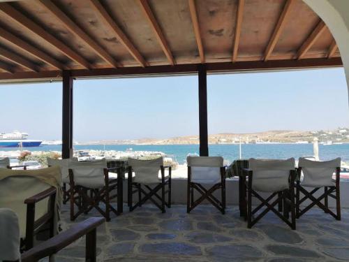 a dining room with a view of the ocean at Asterias Hotel in Parikia