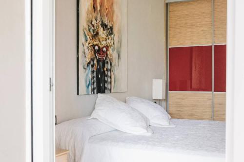Ένα ή περισσότερα κρεβάτια σε δωμάτιο στο Apartamento luminoso cerca del mar y la montaña