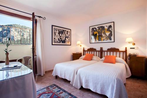 Cama ou camas em um quarto em Juma Historic Hotel