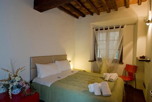 Ένα ή περισσότερα κρεβάτια σε δωμάτιο στο Vicolo dell'Oste