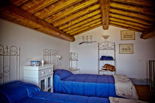 Ένα ή περισσότερα κρεβάτια σε δωμάτιο στο Agriturismo Specchio Del Lago
