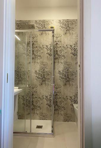a shower with a glass door in a bathroom at Hotel ristorante Bellavista in Colonnella
