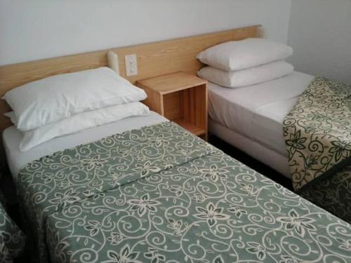 Cama o camas de una habitación en Hotel Calvaire