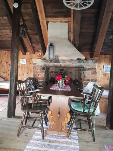 a dining room with a table and chairs in a cabin at Brådtom Slusscafé & Stugor in Norrköping