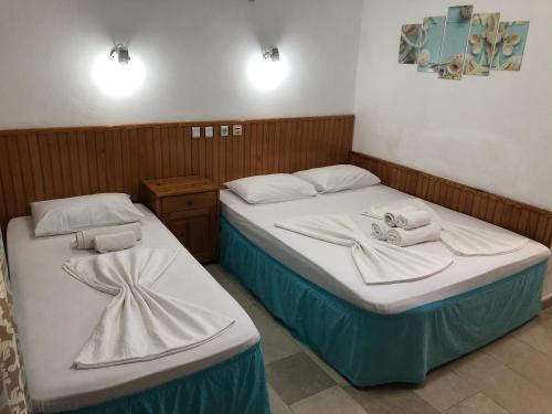 מיטה או מיטות בחדר ב-Side Evin Hotel