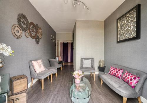 a living room with couches and chairs and a table at Best Western Le Vinci Loire Valley in Amboise