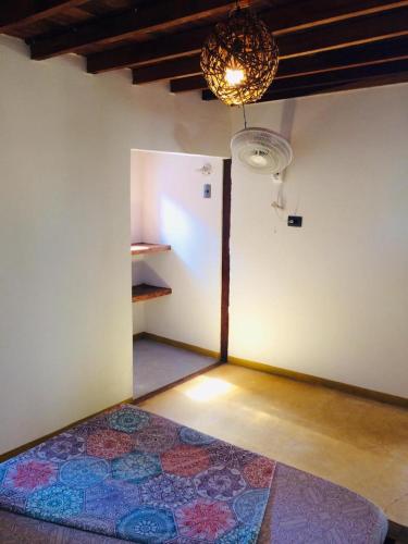 a room with a room with a rug on the floor at Cabañas Luna Escondida in Capurganá
