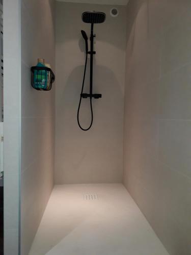 a corner of a room with a light on the wall at Appartement cosy au coeur du Beaujolais in Saint-Lager