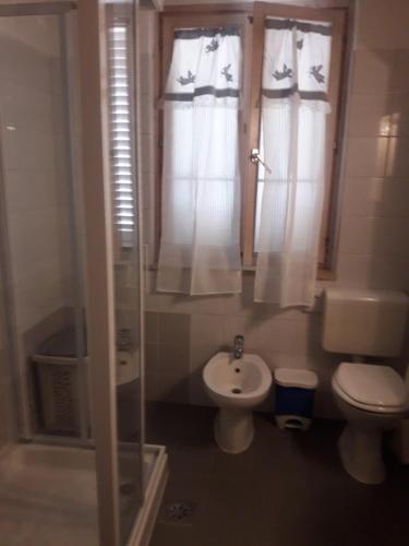 a bathroom with a toilet and a sink at ITA in Piran