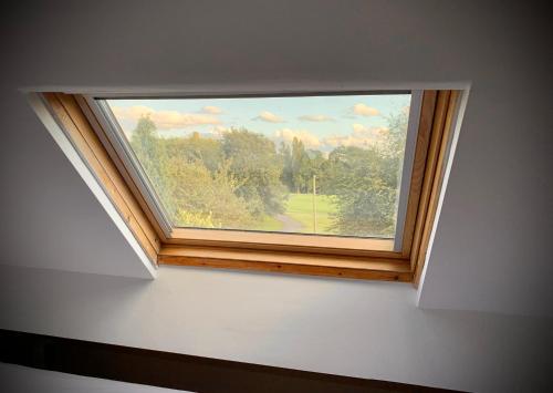 a window in a white room with a view at Manchester Stay Hotel - Free Parking in Manchester