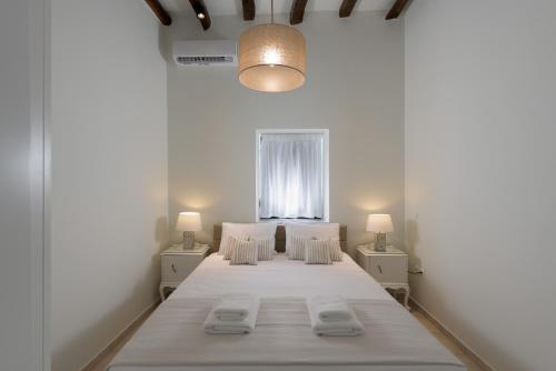 Säng eller sängar i ett rum på Kite Blue Villas