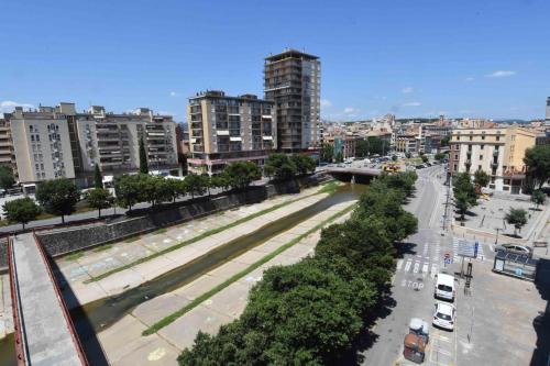 a view of a city with buildings and a street at APG Girona Carme 19 in Girona