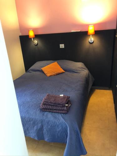 a bedroom with a bed with two towels on it at Viangella - Dramatic sea view! Top floor 2km to Monaco in Cap d'Ail