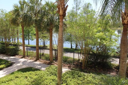 a fence with palm trees in a park at 205 - Disney, Universal, Convention Center in Orlando