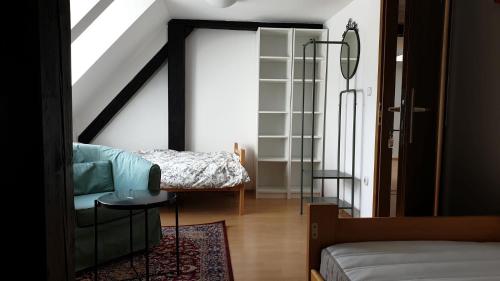 a living room with a bed and a table at Samostan Mekinje in Kamnik