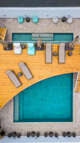a model of a swimming pool with towels and seats at Deluxe Suites Santorini in Fira