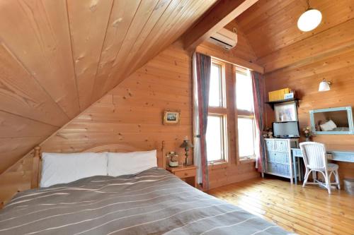 Postel nebo postele na pokoji v ubytování Carrefour Guesthouse カルフール ゲストハウス